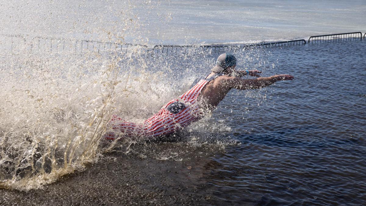Diver in a red striped suit.
