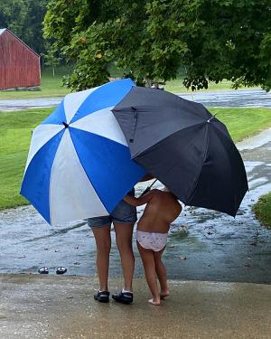 Competition entry: sisterly love in the rain